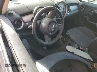 2011 MINI Hardtop z VIN WMWSU3C52BT094502, wystawiony jako Copart lot #56579965 z przebiegiem Nie podano mil oraz Szkoda całkowita • Salvage title. Historia ofert i sprzedaży dostępna na DreamBid. Obrazek 8.