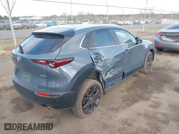 2023 Mazda CX-30 S Carbon Edition with VIN 3MVDMBCM1PM573317, listed as a IAAI auction lot 41785371 with 6,475 mi miles and . Bid and sale history available at DreamBid. Image 4.