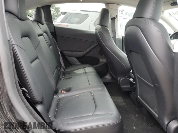 2023 Tesla Model Y Long Range z VIN 7SAYGDEE0PF869710, wystawiony jako Copart lot #52885365 z przebiegiem 13 919 mil mil oraz Szkoda całkowita • Salvage title. Historia ofert i sprzedaży dostępna na DreamBid. Obrazek 10.
