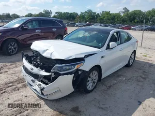 2016 Kia Optima EX z VIN 5XXGU4L31GG064220, wystawiony jako IAAI lot #39443639 z przebiegiem 98 808 mil mil oraz . Historia ofert i sprzedaży dostępna na DreamBid. Obrazek 2.