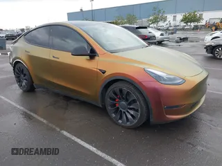 2023 Tesla Model Y Performance with VIN 7SAYGDEF4PF738885, listed as a IAAI auction lot 41798997 with 59,270 mi miles and . Bid and sale history available at DreamBid. Image 1.