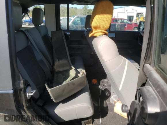 2009 Jeep Wrangler Unlimited X with VIN 1J4GA391X9L788932, listed as a Copart auction lot 49004925 with 105,674 mi miles and Salvage Title. Bid and sale history available at carsss.com. Image 10.