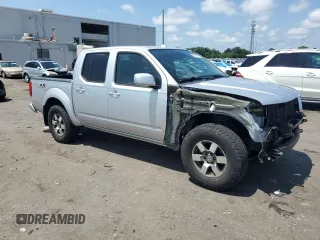 2010 Nissan Frontier Pro-4X with VIN 1N6AD0EV5AC435641, listed as a Copart auction lot 63388025 with 84,349 mi miles and Salvage title. Bid and sale history available at DreamBid. Image 4.