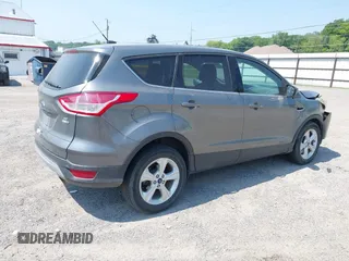 2014 Ford Escape SE with VIN 1FMCU9GXXEUE08655, listed as a IAAI auction lot 42469634 with 163,054 mi miles and . Bid and sale history available at DreamBid. Image 4.