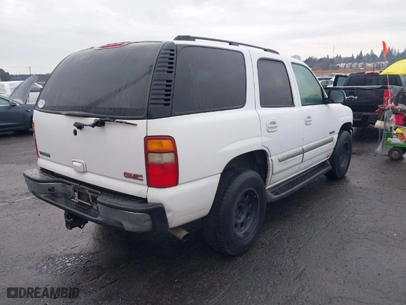 2003 GMC Yukon SLT with VIN 1GKEC13T73R281551, listed as a IAAI auction lot 41522305 with 214,489 mi miles. Bid and sale history available at carsss.com. Image 4.