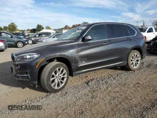 2015 BMW X5 xDrive35i with VIN 5UXKR0C52F0K52569, listed as a Copart auction lot 76691114 with 150,286 mi miles and Salvage Title. Bid and sale history available at carsss.com. Image 1.
