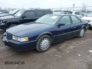 1993 Cadillac Seville Touring STS z VIN 1G6KY5297PU804313, wystawiony jako IAAI lot #42001104 z przebiegiem 242 756 mil mil oraz . Historia ofert i sprzedaży dostępna na DreamBid. Obrazek 2.
