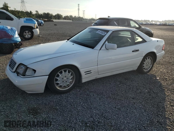 1997 Mercedes-Benz SL 500 with VIN WDBFA67FXVF149930, listed as a Copart auction lot 64749525 with 88,523 mi miles and Salvage title. Bid and sale history available at DreamBid. Image 1.