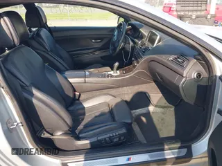 2013 BMW 6 Series 650i z VIN WBAYM9C57DDW20410, wystawiony jako IAAI lot #42348010 z przebiegiem 146 985 mil mil oraz . Historia ofert i sprzedaży dostępna na DreamBid. Obrazek 5.