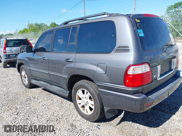 2003 Lexus LX with VIN JTJHT00W233532297, listed as a IAAI auction lot 42189676 with 235,992 mi miles. Bid and sale history available at carsss.com. Image 3.