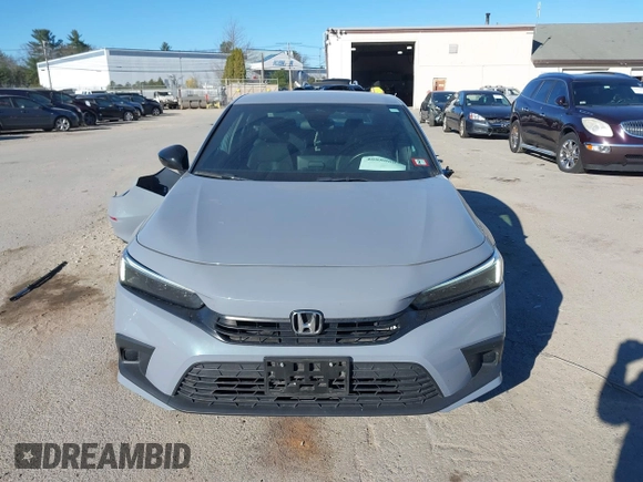2022 Honda Civic Sport z VIN 2HGFE2F50NH601567, wystawiony jako IAAI lot #40880687 z przebiegiem 16 587 mil mil oraz . Historia ofert i sprzedaży dostępna na DreamBid. Obrazek 13.