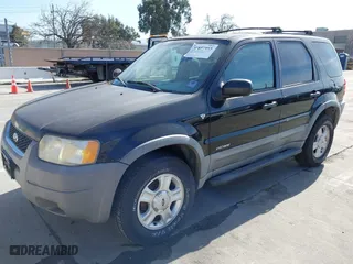 2001 Ford Escape XLT with VIN 1FMCU03181KA15501, listed as a IAAI auction lot 41857955 with 157,344 mi miles. Bid and sale history available at carsss.com. Image 2.