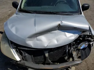 2009 Nissan Versa 1.6 z VIN 3N1CC11E09L445460, wystawiony jako Copart lot #74360764 z przebiegiem 202 122 mil mil oraz Szkoda całkowita • Salvage title. Historia ofert i sprzedaży dostępna na DreamBid. Obrazek 12.