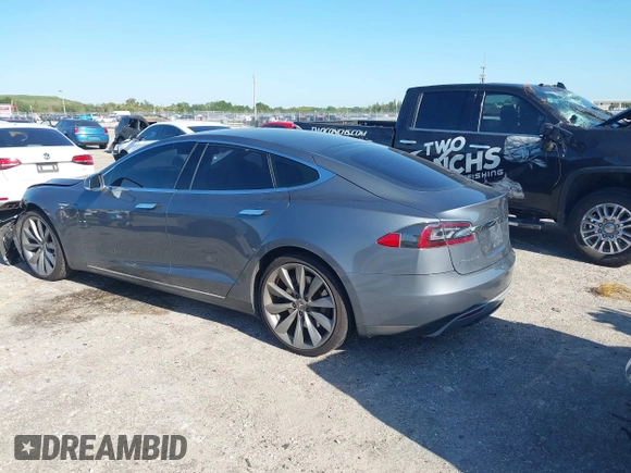 2014 Tesla Model S 60 with VIN 5YJSA1H1XEFP31911, listed as a IAAI auction lot 42029215 with Not Provided miles and . Bid and sale history available at DreamBid. Image 3.