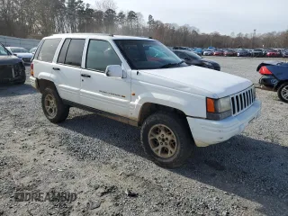 1996 Jeep Grand Cherokee Limited with VIN 1J4GZ78S2TY123592, listed as a Copart auction lot 84387624 with Not Provided miles and Salvage Title. Bid and sale history available at carsss.com. Image 4.
