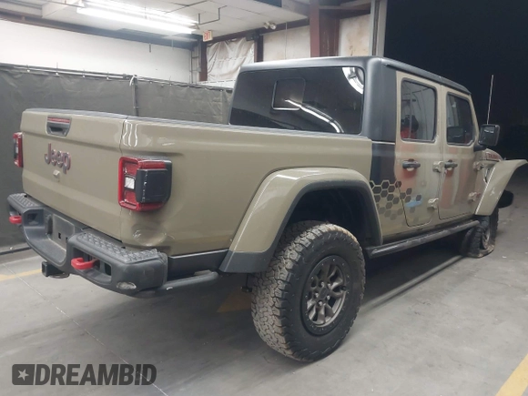 2020 Jeep Gladiator Rubicon z VIN 1C6JJTBGXLL178893, wystawiony jako IAAI lot #42206863 z przebiegiem 29 138 mil mil oraz . Historia ofert i sprzedaży dostępna na DreamBid. Obrazek 4.