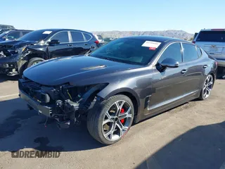 2019 Kia Stinger GT with VIN KNAE35LC3K6059198, listed as a IAAI auction lot 41599686 with 82,886 mi miles. Bid and sale history available at carsss.com. Image 2.