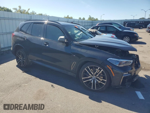 2020 BMW X5 M50i with VIN 5UXJU4C05LL228167, listed as a Copart auction lot 70390194 with Not Provided miles and Salvage Title. Bid and sale history available at DreamBid. Image 4.