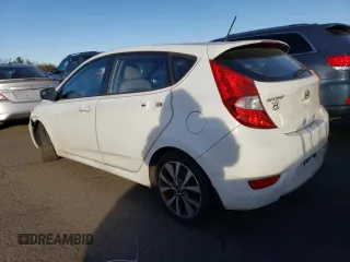 2015 Hyundai Accent Sport with VIN KMHCU5AE2FU217782, listed as a Copart auction lot 41446935 with 99,764 mi miles and Clean Title. Bid and sale history available at carsss.com. Image 2.