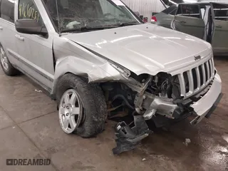 2009 Jeep Grand Cherokee Laredo with VIN 1J8GR48KX9C516873, listed as a IAAI auction lot 41610781 with 199,246 mi miles. Bid and sale history available at carsss.com. Image 6.
