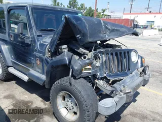 2001 Jeep Wrangler Sahara with VIN 1J4FA59SX1P337951, listed as a IAAI auction lot 42087134 with 154,479 mi miles and . Bid and sale history available at carsss.com. Image 13.