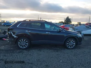 2014 Mazda CX-9 Grand Touring with VIN JM3TB3DV7E0429276, listed as a IAAI auction lot 41415446 with 94,939 mi miles and . Bid and sale history available at DreamBid. Image 14.