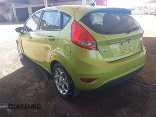 2011 Ford Fiesta SES with VIN 3FADP4FJ9BM119319, listed as a IAAI auction lot 42025691 with 104,516 mi miles. Bid and sale history available at carsss.com. Image 3.