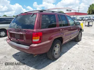 2000 Jeep Grand Cherokee Laredo with VIN 1J4G258S4YC381030, listed as a IAAI auction lot 42541918 with 306,934 mi miles and . Bid and sale history available at DreamBid. Image 4.