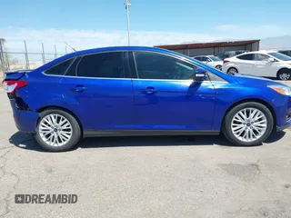 2015 Ford Focus Titanium with VIN 1FADP3J25FL314903, listed as a IAAI auction lot 42053132 with 125,418 mi miles and . Bid and sale history available at carsss.com. Image 14.