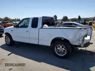2002 Ford F-150 XL with VIN 1FTRX17212NA28461, listed as a Copart auction lot 63710665 with 185,460 mi miles and Salvage title. Bid and sale history available at DreamBid. Image 2.
