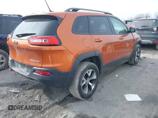 2015 Jeep Cherokee Trailhawk with VIN 1C4PJMBB3FW642266, listed as a IAAI auction lot 41510571 with 72,030 mi miles and . Bid and sale history available at DreamBid. Image 4.
