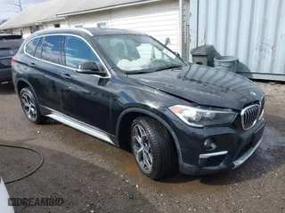 2018 BMW X1 xDrive28i with VIN WBXHT3C35J5L34646, listed as a IAAI auction lot 41725131 with NaN miles. Bid and sale history available at carsss.com. Image 1.