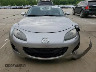 2009 Mazda MX-5 Miata Grand Touring z VIN JM1NC25F090202047, wystawiony jako Copart lot #55810505 z przebiegiem 91 618 mil mil oraz Szkody całkowita. Historia ofert i sprzedaży dostępna na DreamBid. Obrazek 5.