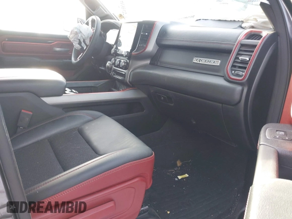 2022 Ram 1500 Rebel z VIN 1C6SRFLT9NN204868, wystawiony jako IAAI lot #41351273 z przebiegiem 67 120 mil mil oraz . Historia ofert i sprzedaży dostępna na DreamBid. Obrazek 5.
