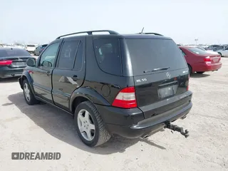 2001 Mercedes-Benz M-Class AMG with VIN 4JGAB74E51A272841, listed as a IAAI auction lot 41734340 with 168,387 mi miles. Bid and sale history available at carsss.com. Image 3.