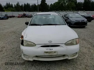 1999 Hyundai Accent with VIN KMHVD14N9XU503210, listed as a Copart auction lot 56486325 with 195,501 mi miles and Salvage title. Bid and sale history available at DreamBid. Image 13.