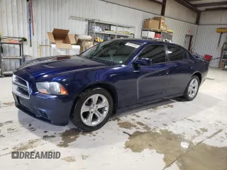 2014 Dodge Charger SXT z VIN 2C3CDXHG8EH156161, wystawiony jako Copart lot #58161945 z przebiegiem 246 923 mil mil oraz Czysty tytuł • Clean title. Historia ofert i sprzedaży dostępna na DreamBid. Obrazek 1.