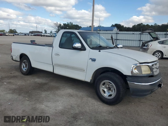 1999 Ford F-150 z VIN 1FTRF17W9XNB67119, wystawiony jako Copart lot #79197414 z przebiegiem Nie podano mil oraz Szkoda całkowita • Salvage title. Historia ofert i sprzedaży dostępna na DreamBid. Obrazek 4.