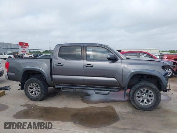2017 Toyota Tacoma SR5 with VIN 5TFAZ5CN4HX047095, listed as a IAAI auction lot 41951364 with 127,706 mi miles and . Bid and sale history available at DreamBid. Image 14.