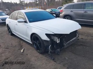 2014 Audi A6 3.0T Prestige with VIN WAUHGAFC8EN137457, listed as a IAAI auction lot 41854825 with 37,111 mi miles. Bid and sale history available at carsss.com. Image 1.