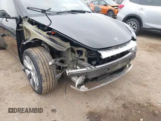 2023 Tesla Model Y Long Range with VIN 7SAYGDEEXPA044335, listed as a IAAI auction lot 42350159 with 26,731 mi miles and . Bid and sale history available at DreamBid. Image 6.