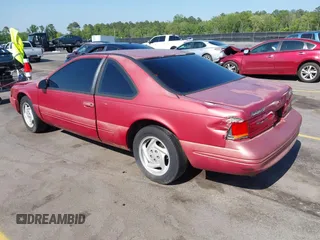 1996 Ford Thunderbird LX with VIN 1FALP62W0TH142986, listed as a IAAI auction lot 42030900 with 168,993 mi miles. Bid and sale history available at carsss.com. Image 3.