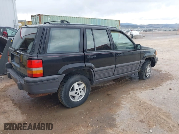 1994 Jeep Grand Cherokee Laredo with VIN 1J4GZ58S2RC118838, listed as a IAAI auction lot 42047224 with 160,715 mi miles. Bid and sale history available at carsss.com. Image 4.