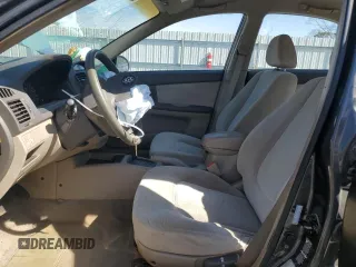 2004 Kia Spectra LX with VIN KNAFE121X45021922, listed as a Copart auction lot 49989845 with 184,189 mi miles and Salvage Title. Bid and sale history available at carsss.com. Image 7.