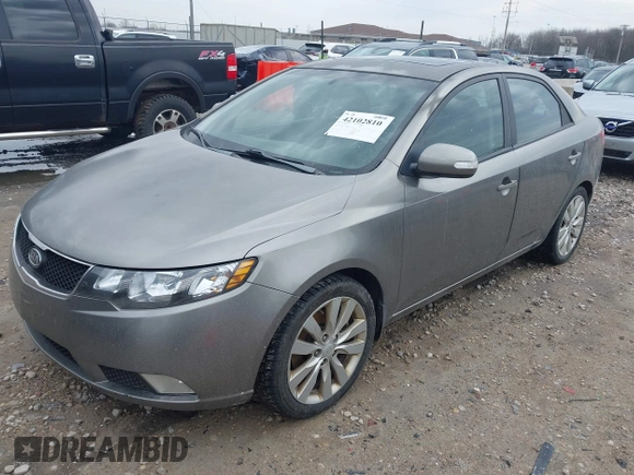 2010 Kia Forte SX with VIN KNAFW4A31A5048066, listed as a IAAI auction lot 42102810 with 160,998 mi miles. Bid and sale history available at carsss.com. Image 2.