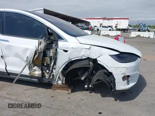 2021 Tesla Model X Long Range Plus with VIN 5YJXCBE23MF321243, listed as a IAAI auction lot 42100580 with 59,878 mi miles and . Bid and sale history available at carsss.com. Image 6.