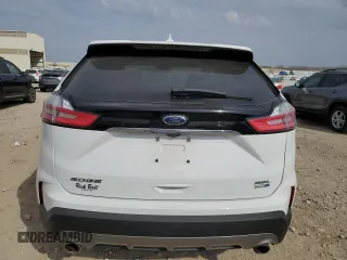 2020 Ford Edge SEL с VIN 2FMPK4J91LBA69663, выставлен на аукционе Copart как лот 50611005 с пробегом 61 534 миль миль и Списание • Salvage title. История ставок и продаж доступна на DreamBid. Изображение 6.