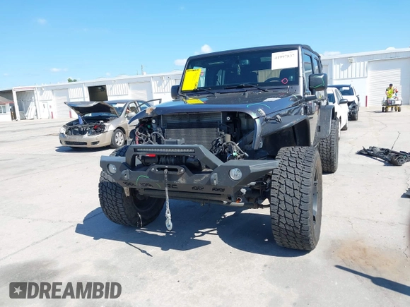 2014 Jeep Wrangler Unlimited Sport with VIN 1C4BJWDG4EL295044, listed as a IAAI auction lot 41997837 with 143,447 mi miles. Bid and sale history available at carsss.com. Image 12.