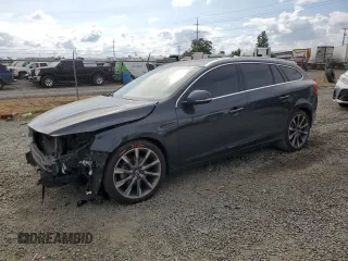 2015 Volvo V60 T5 Drive-E Premier with VIN YV140MEKXF1259241, listed as a Copart auction lot 66890004 with 117,600 mi miles and Salvage Title. Bid and sale history available at carsss.com. Image 1.