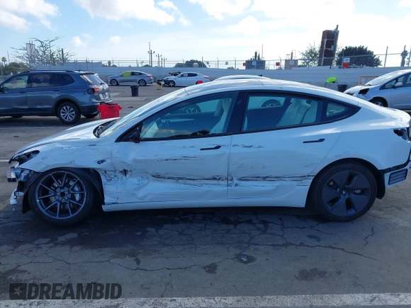 2023 Tesla Model 3 with VIN 5YJ3E1EA6PF495631, listed as a IAAI auction lot 41568118 with 10,073 mi miles and . Bid and sale history available at DreamBid. Image 6.